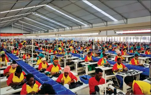  ?? The Associated Press ?? ETHIOPIA: Ethiopian factory workers make shoes Jan. 5 at the Chinese company Huajian’s plant in Addis Ababa, Ethiopia. Workers from at Ganzhou Huajian Internatio­nal Shoe City Co., a southeaste­rn China factory used by Ivanka Trump and other fashion...