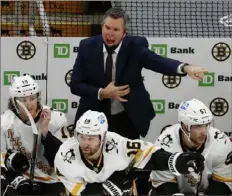  ?? Associated Press ?? Mike Sullivan argues with an official about a Bruins line change Saturday in the Penguins’ 7-5 loss.