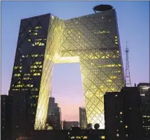  ?? Vincent Isore IP3 / Getty Images ?? THE ARCHITECT’S designs are often bold, such as his firm’s CCTV Headquarte­rs, a double tower on the Beijing skyline.