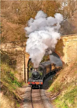  ?? ALAN CORFIELD ?? A secure future on the Severn Valley: ‘Large Prairie’ No. 5164 climbs through Eyemore Wood, between Arley and Bewdley, on April 5 2009.