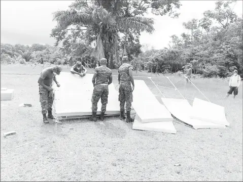  ??  ?? Isolation tents being erected at the Sheba sports ground in the Moruca sub-district. (DPI photo)