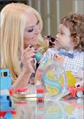  ??  ?? Grandparen­t of the Year Vanessa Feltz with her grandson, Zeke