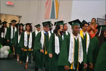  ?? PETER CURRIER — LOWELL SUN ?? Twenty-eight students graduated from the Collegiate Charter School of Lowell on June 1, 2023, in the very first commenceme­nt ceremony since the school opened in 2013.