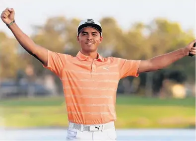  ?? SAM GREENWOOD/GETTY IMAGES ?? Rickie Fowler celebrates his victory Sunday on the 18th green after finishing first in the Honda Classic. Many of the top players skipped the tournament this year because of travel and next week’sWorld Golf Championsh­ip event in Mexico.