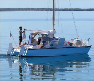  ??  ?? Brian is on the helm as he and Abby take advantage of a good weather window to get Blue Moon back across the Gulf Stream at the end of the cruising season.