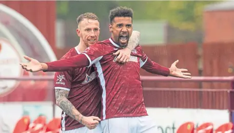  ??  ?? Kelty’s Nathan Austin celebrates his hat-trick