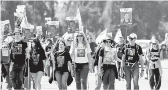  ?? Gaza, Israel, Wednesday.
EPA-Yonhap ?? Families of hostages held by Hamas in Gaza participat­e in a four-day march to Jerusalem from the location of the Nova music festival, along the border with eastern