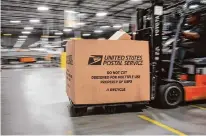  ?? ?? Packages are moved at the center. Over $250 million will be spent on improving operations in the area by the end of 2024.