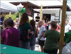  ?? BOB KEELER — MEDIANEWS GROUP ?? Retiring Pennridge track and field Coach Bob Hosier chats with attendees at a surprise party July 31 at the Ram’s beer garden in Perkasie.