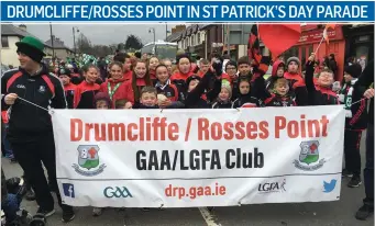 ??  ?? Drumcliffe/Rosses Point players taking part in the St Patrick’s Day parade.