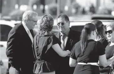  ?? JORGE SALGADO AP ?? El Paso mayor Dee Margo, left, speaks to the family of Andre Anchondo prior to a funeral Saturday for Jordan Anchondo. Andre and Jordan Anchondo died Aug. 3 when a gunman opened fire inside a Walmart. Jordan Anchondo was shielding her baby, while her husband shielded them both.