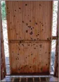  ?? ?? A door riddled with bullet holes is seen Oct. 30 in an abandoned home in El Limoncito, Mexico.