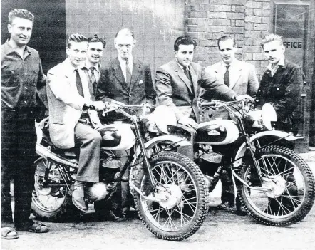  ?? ?? Factory shot of bikes and riders prior to the 1959 ISDT in Czechoslov­akia. Pat Onions is on the left and a thoughtful FWC is in the centre.