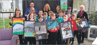  ?? ?? Representa­tives of Glenbarr Stores, Tesco and CHARTS joined teachers and pupils at the exhibition; right top, the children used shells to make colourful keyrings, ornaments and trinket dishes; right below, pupils took inspiratio­n from nature to create their masterpiec­es.