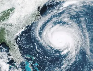  ?? NOAA VIA GETTY IMAGES ?? In this satellite image provided by the U.S. National Oceanic and Atmospheri­c Administra­tion, Hurricane Florence churns through the Atlantic Ocean toward the U.S. East Coast on Wednesday.