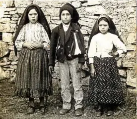  ?? —AFP ?? An undated handout picture released May 9 by Santuari de Fatima shows (from left) Lucia, Francisco and Jacinta Marto. The three shepherds claimed to witness the apparation of the Virgin Mary in Fatima, Portugal, on May 13, 1917.