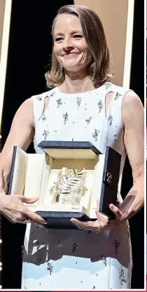  ??  ?? Marion Cotillard (left) arrives to see her new film
Annette open the festival. Jodie Foster receives Cannes’s highest honour, the Palme d’Or (above). Palme d’Or jury president Spike Lee (below) with jury members Mylène Farmer, Maggie Gyllenhaal,
Mélanie Laurent and Jessica Hausner