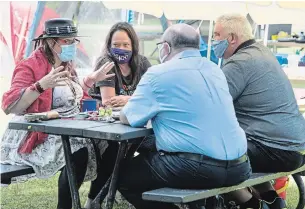  ?? MATHEW MCCARTHY WATERLOO REGION RECORD ?? Terre Chartrand, left, and Amy Smoke meet Friday with Kitchener Mayor Berry Vrbanovic and Waterloo Mayor Dave Jaworsky in Victoria Park where an indigenous camp has been set up. Chartrand and Smoke were asking for protected space in the park for indigenous ceremonies.