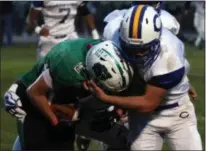  ?? RANDY MEYERS — THE MORNING JOURNAL ?? Clearview’s Drew Engle stops Columbia’s Mike Lovell after a short gain during the first quarter on Oct. 6.