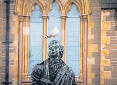  ?? Macdougall. Picture: Steve ?? A statue commemorat­ing Robert Burns outside the Mcmanus Galleries, in Dundee.