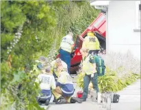  ??  ?? Emergency services at work after a car went off Somme Parade and down the river bank yesterday.