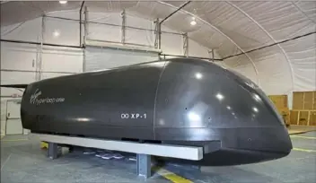  ?? Jessie Wardarski/Post-Gazette ?? A Virgin Hyperloop One pod last year at the company’s testing facility in Apex, Nev. This pod was the first to be tested successful­ly on test track in the Mojave Desert.