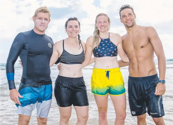  ?? Picture: JERAD WILLIAMS ?? Mick Fanning teaches cycling legend Anna Meares, tandem cyclist Jess Gallagher and swimmer Chad Le Clos how to surf at Kirra Beach.