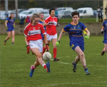  ??  ?? Wicklow’s Aoife Gillen races to tackle Louth’s Aoife Russell in Stabannon on Sunday last.