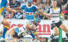  ??  ?? JT crashes over for a try in that 2008 fixture, won 36-18 by the Gold Coast Titans.