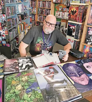  ?? [PHOTO BY MATTHEW PRICE, THE OKLAHOMAN] ?? Artist Jerry Bennett is a guest of honor at the third New World Comic Con.