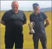  ??  ?? Captain Graeme McLennan presenting George MacMillan with the Championsh­ip Trophy.