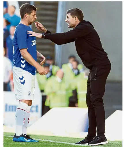  ??  ?? Ye hear me: Rangers manager Steven Gerrard (right) giving instructio­ns to Jon Flanagan during the preseason friendly match against Bury at the Ibrox Stadium in Glasgow on July 6. — AP