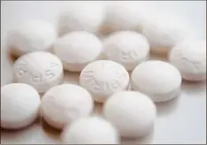  ?? Patrick Sison / Associated Press ?? A large study finds that low-dose and regular-strength aspirin seem equally safe and effective for preventing additional heart problems in people who have heart disease.