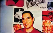  ??  ?? Sex killer Luka Magnotta, serving life in a Quebec prison,
poses happily against the backdrop of his posters.