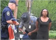  ?? ASSOCIATED PRESS ?? Bree Newsome of Charlotte, N.C., is taken into custody after she removed the Confederat­e flag from a monument in 2015.