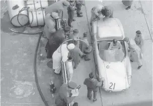  ??  ?? Bottom left Preparing to leave the pits after a long stop to fix an ignition problem, while Huschke van Hanstein leans into the cockpit next to codriver, Jo Bonnier