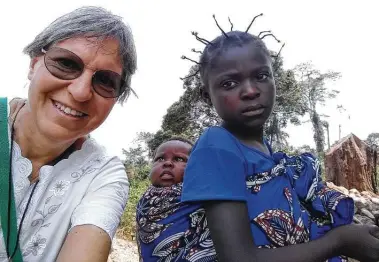  ?? Sister Luzia Premoli / Associated Press file photo ?? Sister Luzia Premoli takes a selfie with a young girl in the village of Bagandou in the Central African Republic in February. In 2014, Pope Francis appointed Premoli, a nun from Brazil, to a Vatican congregati­on.