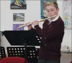  ??  ?? irst year student Darren Levingston­e on the flute.
