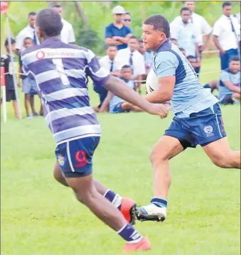  ?? Picture: ATU RASEA ?? A QVS player on attack against Lelean Memorial School in the U17 play-off at the St Marcellin Primary School ground in Vatuwaqa yesterday.
