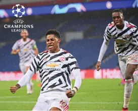  ?? (AFP) ?? Man United's Marcus Rashford celebrates after scoring against PSG in Paris, France, on Tuesday