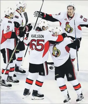  ?? AP PHOTO ?? Ottawa Senators’ Mark Stone (61) and Erik Karlsson (65) celebrate with teammates during Game 6 of an NHL Stanley Cup second-round playoff series Tuesday in New York.