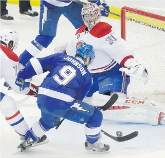  ?? DARIO AYAL/MONTREAL GAZETTE ?? Lightning forward Tyler Johnson scores the game-winning goal on Montreal’s Carey Price on a buzzer beater in Game 3 Wednesday in Tampa. The Lightning could end the series Thursday.