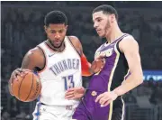  ?? [AP PHOTO] ?? Thunder forward Paul George, left, is pressured by Lakers guard Lonzo Ball during the first half Wednesday.