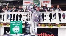  ?? Matt Slocum / Associated Press ?? Alex Bowman, center, driver of car 48, celebrates with his crew after winning the NASCAR Cup Series race at Pocono Raceway on Saturday in Long Pond, Pa.