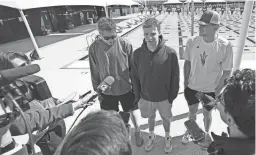  ?? PATRICK BREEN/THE REPUBLIC ?? ASU swimmer Léon Marchand speaks during a news conference, along with teammates Jack Dolan, left, and Grant House Monday.