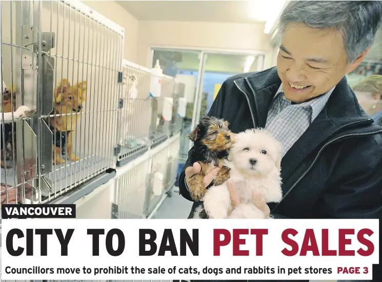  ?? RIC ERNST/PNG ?? Ernest Ang, whose Granville Pet and Garden was the focus of a recent public backlash, holds puppies at a store he owned in Richmond before that city banned pet sales.