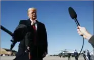  ?? CAROLYN KASTER - THE ASSOCIATED PRESS ?? President Donald Trump talks to reporters before boarding Air Force One, Thursday, Oct. 18, in Andrews Air Force Base, Md., en route to campaign stops in Montana, Arizona and Nevada.