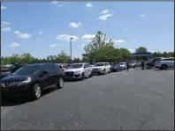  ?? Submitted photo ?? WAITING IN LINE: Drivers line up at Xplore Lakeside for Rotary Mother’s Day takeout dinners.