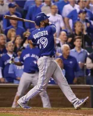  ?? STEVE RUSSELL/TORONTO STAR ?? Toronto’s Jose Bautista hits a two-run homer against the Royals in Kansas City Friday night. For full coverage, go to thestar.com or Star Touch, our new, free iPad app, available at the app store.