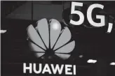  ?? Stefan Wermuth / AFP /Getty Images ?? Chinese tech giant Huawei appears to be thriving despite the U.S. telling allies that the company could be used as an espionage tool by Beijing.
